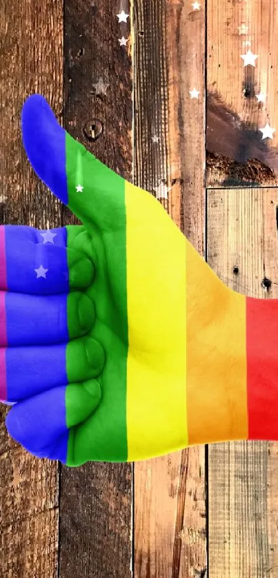 Rainbow thumbs up on a wooden background wallpaper.