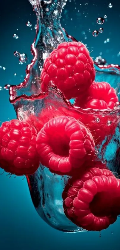 Vibrant red raspberries splashing into clear water, set on a cyan blue background.