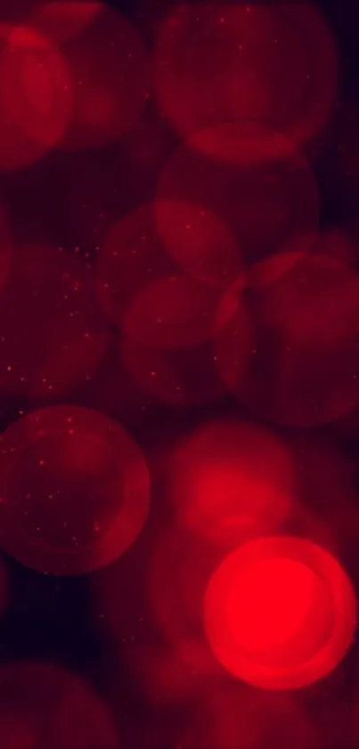 Red bokeh wallpaper with circular patterns.