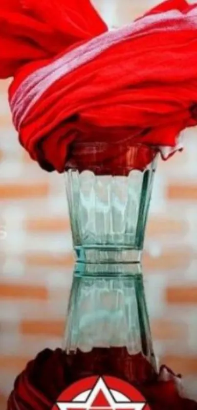 Red turban in glass on brick background.