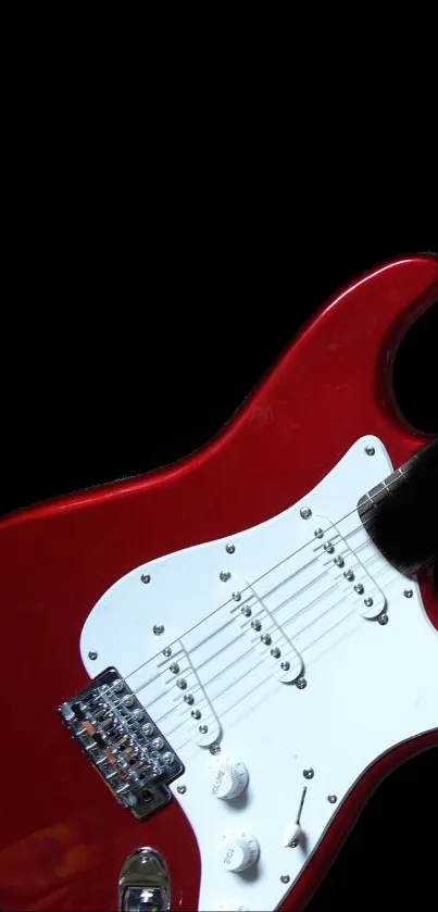 Stylish red electric guitar on a sleek black background, perfect for music fans.