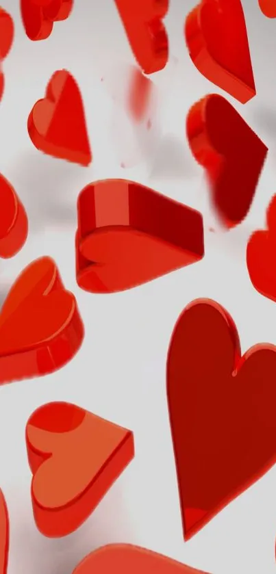 Vibrant red 3D hearts on gray background wallpaper.