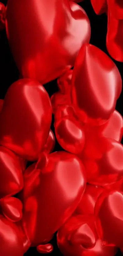 Glossy red 3D hearts on a black background.