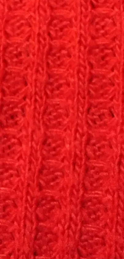 Vibrant red knitted pattern texture wallpaper.