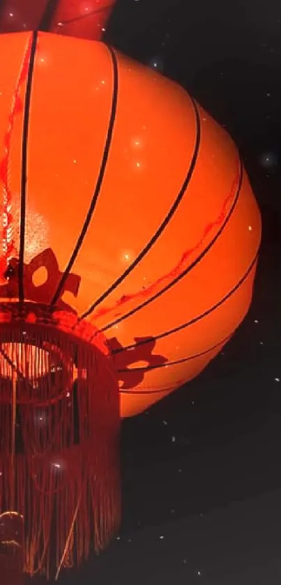 A vibrant red Chinese lantern glowing in darkness.