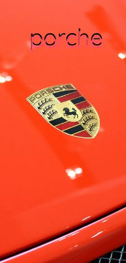 Red Porsche car with logo on hood, minimalist design.