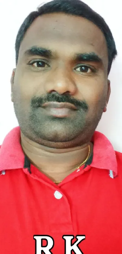 Portrait of a man wearing a striking red shirt, perfect for a wallpaper.