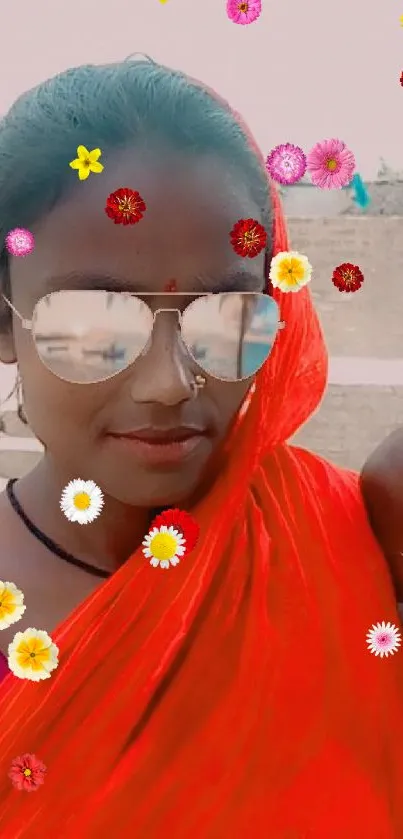 Woman wearing a vibrant red sari and sunglasses.