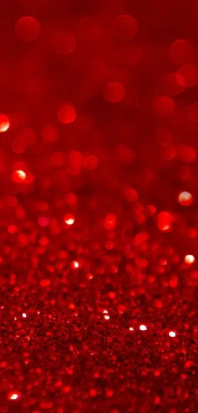 Vibrant red glitter bokeh wallpaper with sparkling texture.