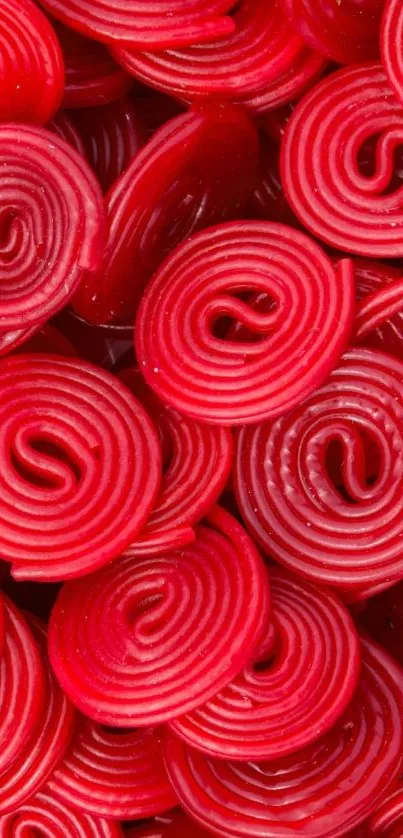 Close-up view of red candy spirals for mobile wallpaper.