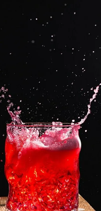 Red liquid splash captured in motion against a dark background.