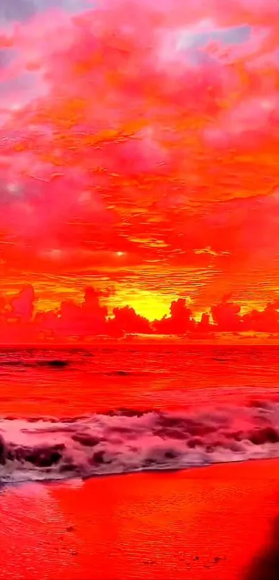 Vibrant red beach sunset with ocean waves and colorful sky.