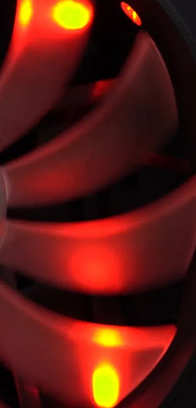 Vibrant red tech fan glowing brightly in the dark.