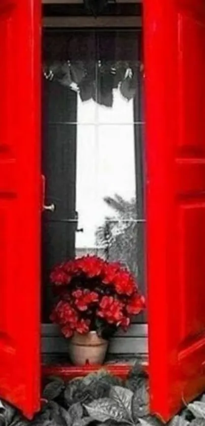 Mobile wallpaper featuring a vibrant red window with surrounding foliage.