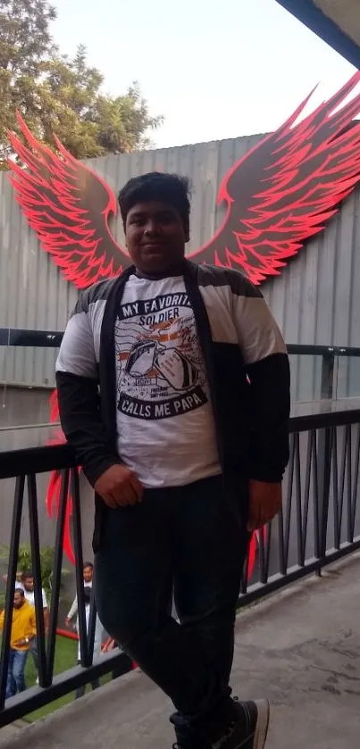 Person poses with vibrant red wings in an urban outdoor setting.