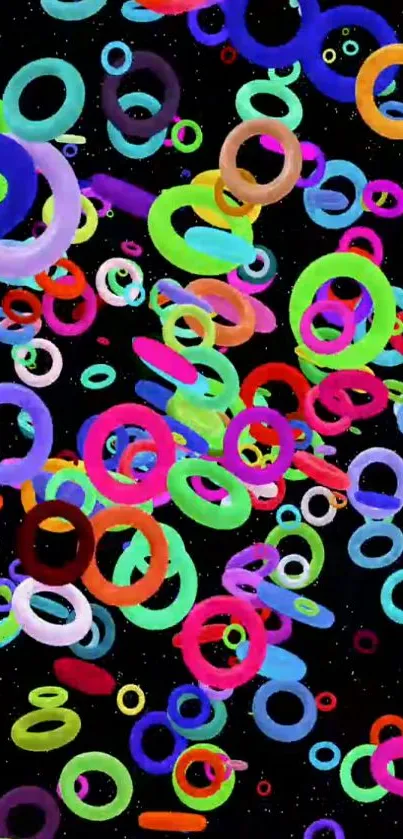 Vibrant mobile wallpaper with colorful rings on black background.