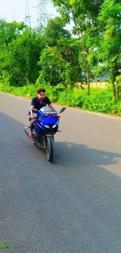 Biker on a green road with lush nature surrounding the path.