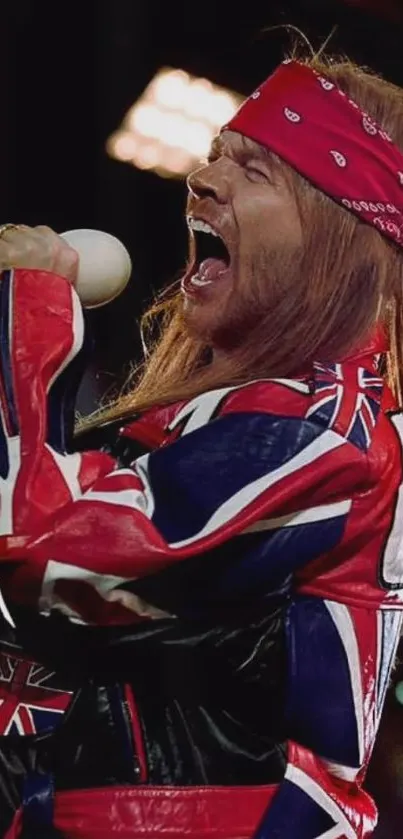 Dynamic singer on stage in Union Jack attire with a red bandana.