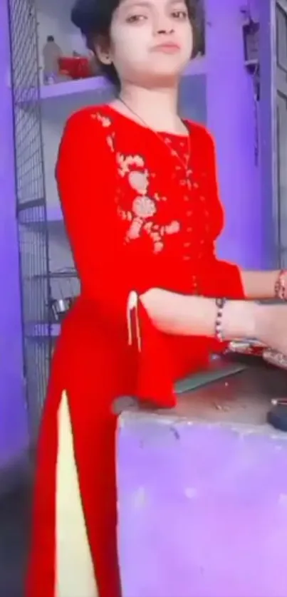 Woman in red dress in vibrant room setting