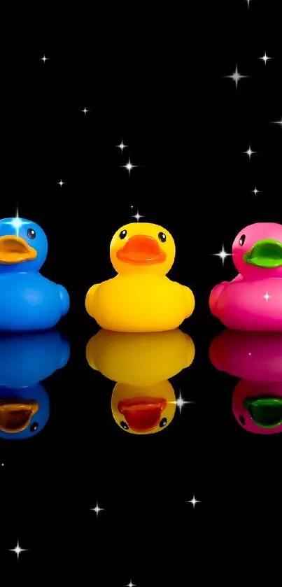 Vibrant trio of rubber ducks on a black background.