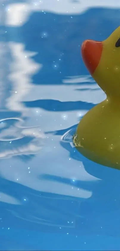 Rubber duck floating on blue water with ripples.