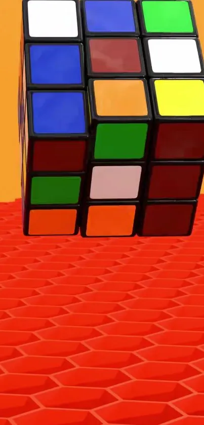 Colorful Rubik's Cube on orange background.