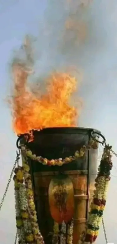 Sacred fire ritual with vibrant flames and floral decorations.