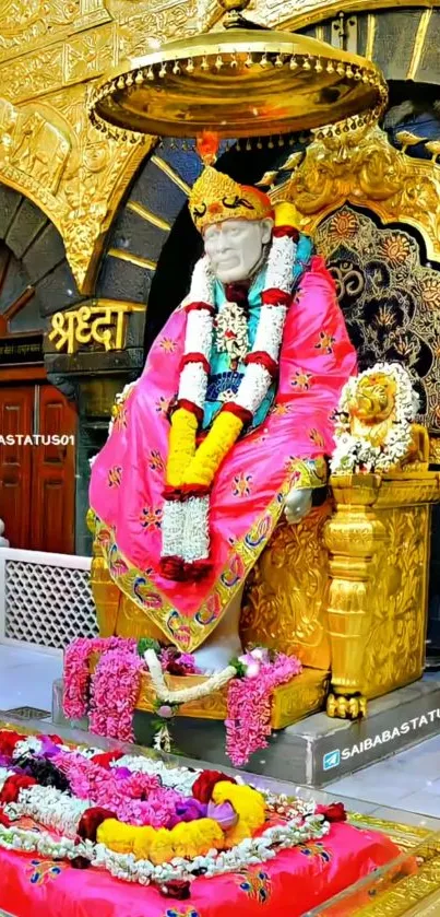 Colorful Sai Baba shrine with intricate golden details.