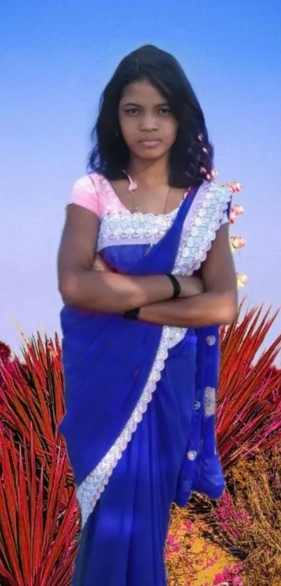 Woman in blue saree, colorful artistic background.