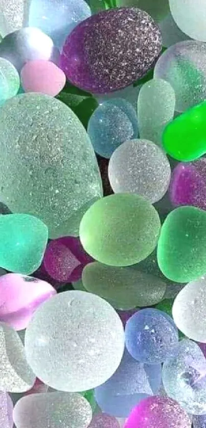 Colorful sea glass pebbles forming a vibrant and textured mobile wallpaper.