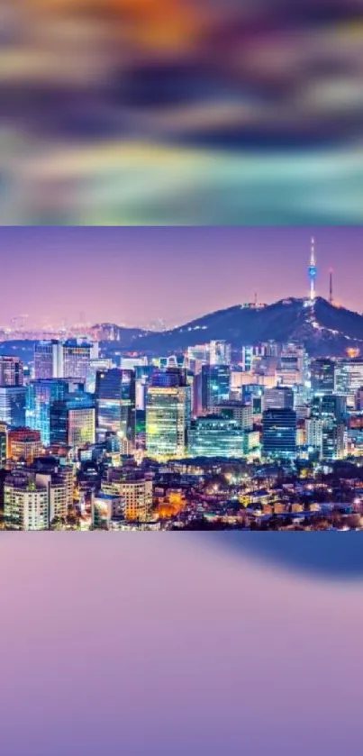 Seoul skyline showing vibrant lights and Namsan Tower with a purple hue.