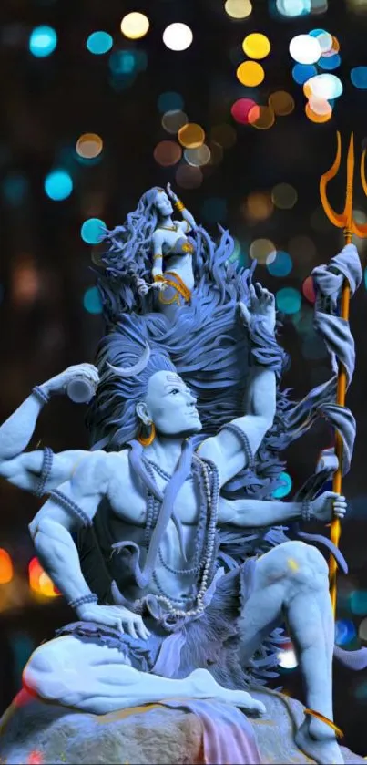 Vibrant Shiva statue with colorful lights.