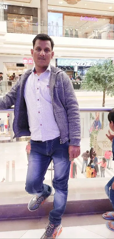 Man and child in a vibrant shopping mall with colorful surroundings.