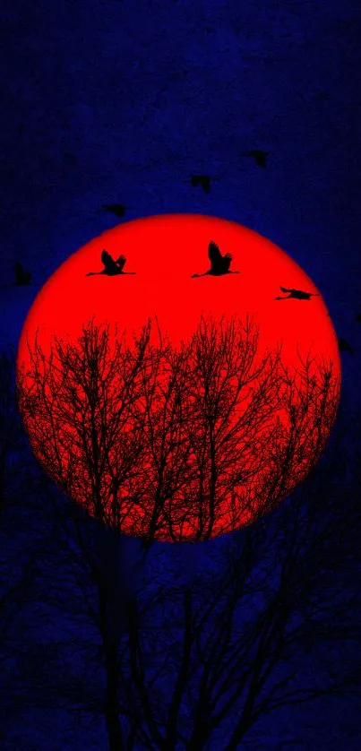 A striking red sun setting behind silhouetted trees with birds flying in the dark sky.