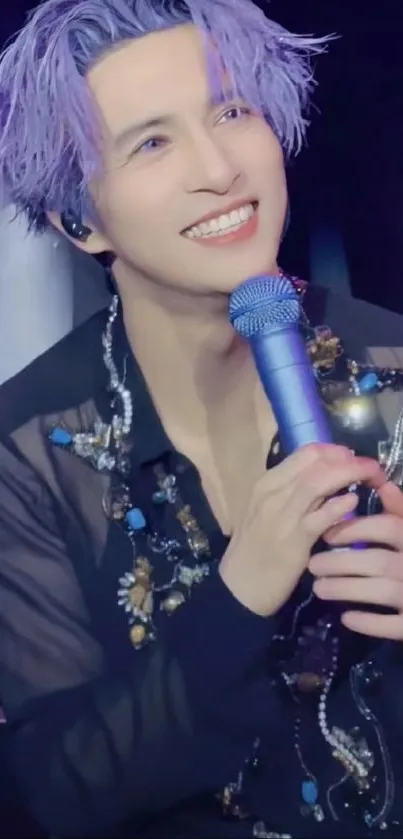 Purple-haired singer holding blue microphone, smiling on stage.