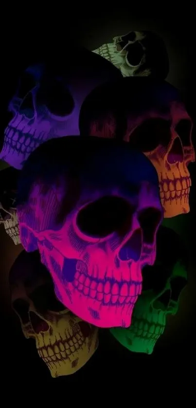 Colorful neon skulls on black background wallpaper.