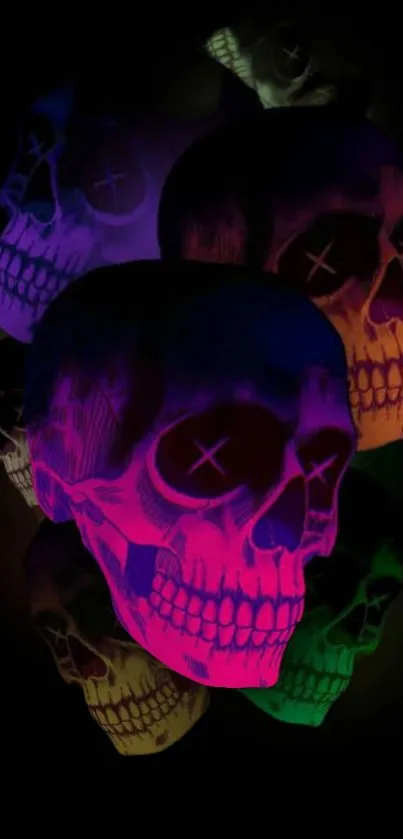 Vibrant neon skulls on a dark background mobile wallpaper.