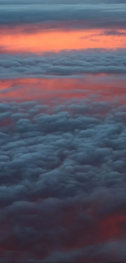 Vibrant orange and blue clouds at sunset, ideal for a mobile wallpaper.