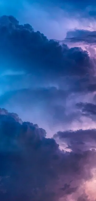 Vibrant purple and blue cloudy sky wallpaper for mobile devices.