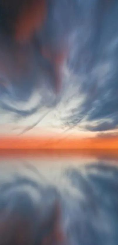 Vivid sunset sky with dramatic clouds reflecting on water.