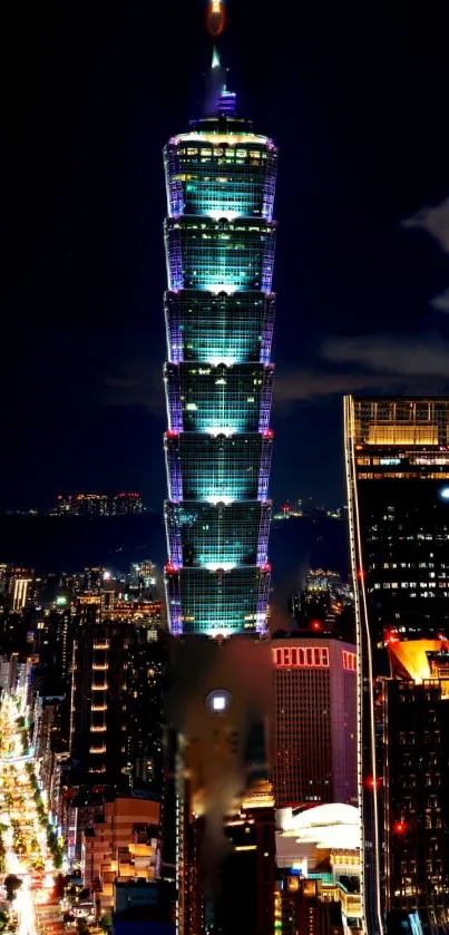 Nighttime view of Taipei skyline with illuminated buildings.