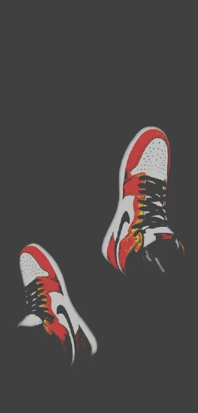 Red and white sneakers on a dark gray background.