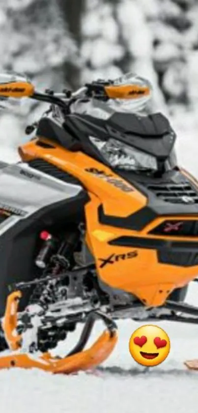 Orange snowmobile in snowy landscape.