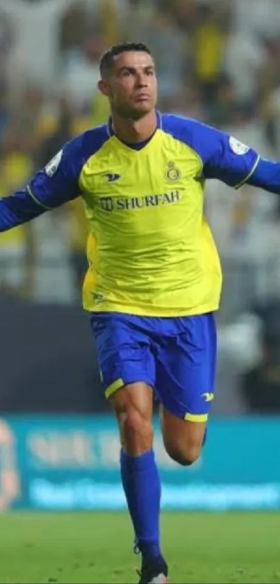 Soccer player celebrating a goal on the field with vibrant yellow uniform.