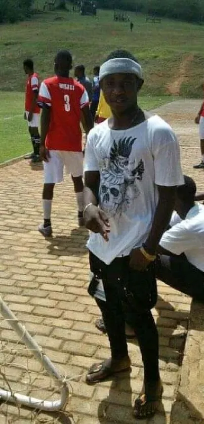 Active soccer game at a green field with players in action and spectators watching.