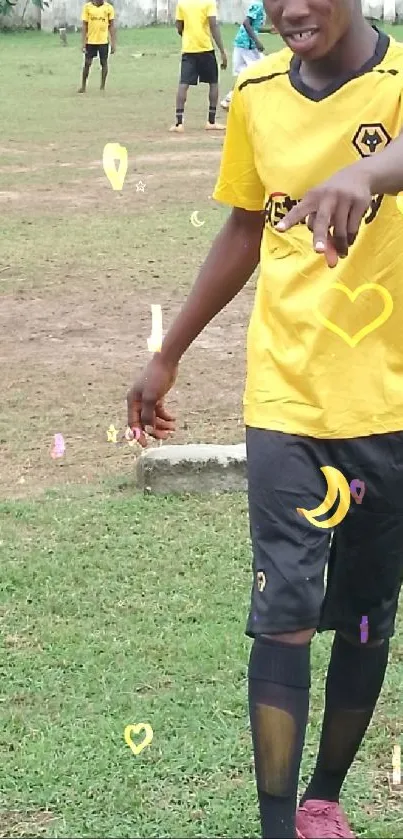 Soccer players in yellow jerseys with hearts on a grassy field.