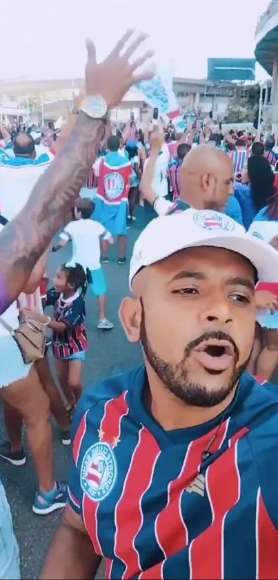 Energetic soccer fans celebrating outside a stadium in colorful jerseys and caps.