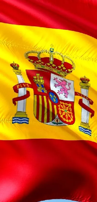 Spanish flag waving against a blue sky.