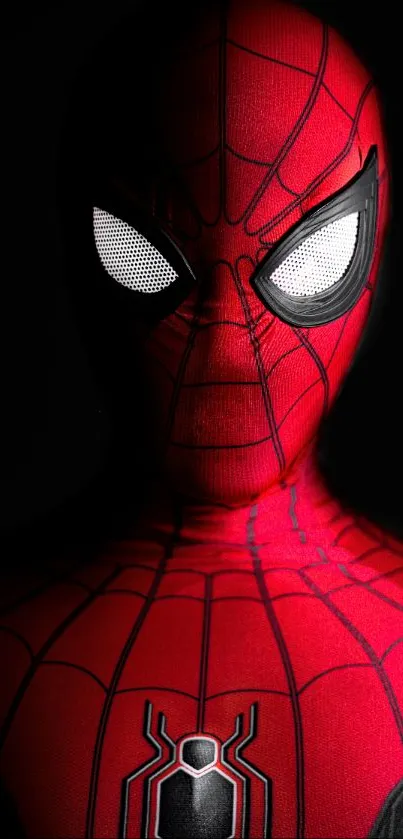 Striking mobile wallpaper with a red spider-themed superhero suit.