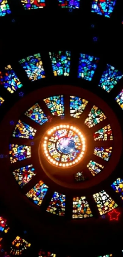 Spiral stained glass art with vibrant colors around a central light.
